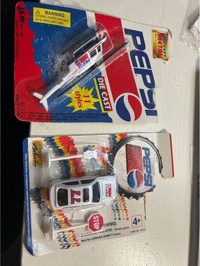 2 unopened 1990s Pepsi vehicles